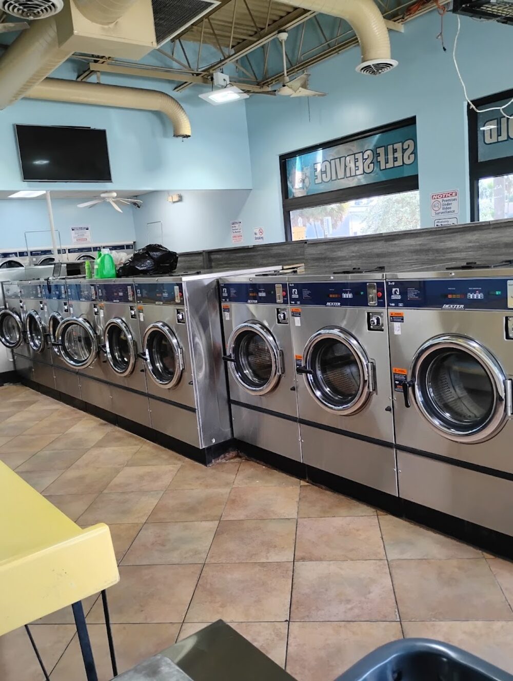 Rows of clean washing machines inside Good Way Laundromat